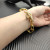 David Yurman Gold Cable Bracelet with Diamond-Set Rotating Clasp