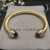 David Yurman 7mm Gold Cable Cuff Bracelet with Red Diamond End Caps and Inlay