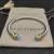 David Yurman 5mm Gold Cable Bracelet with Faceted Edge Design and Blue Diamonds