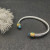 David Yurman 5mm Gold Cable Bracelet with Faceted Edge Design and Blue Diamonds